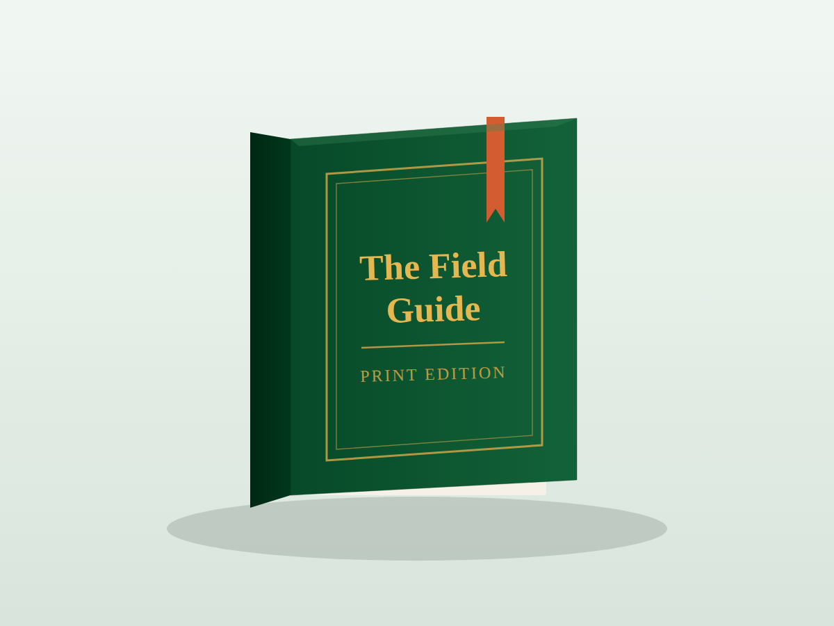 A green clothbound copy of The Field Guide, print edition, with a gold-foil title and ribbon bookmark